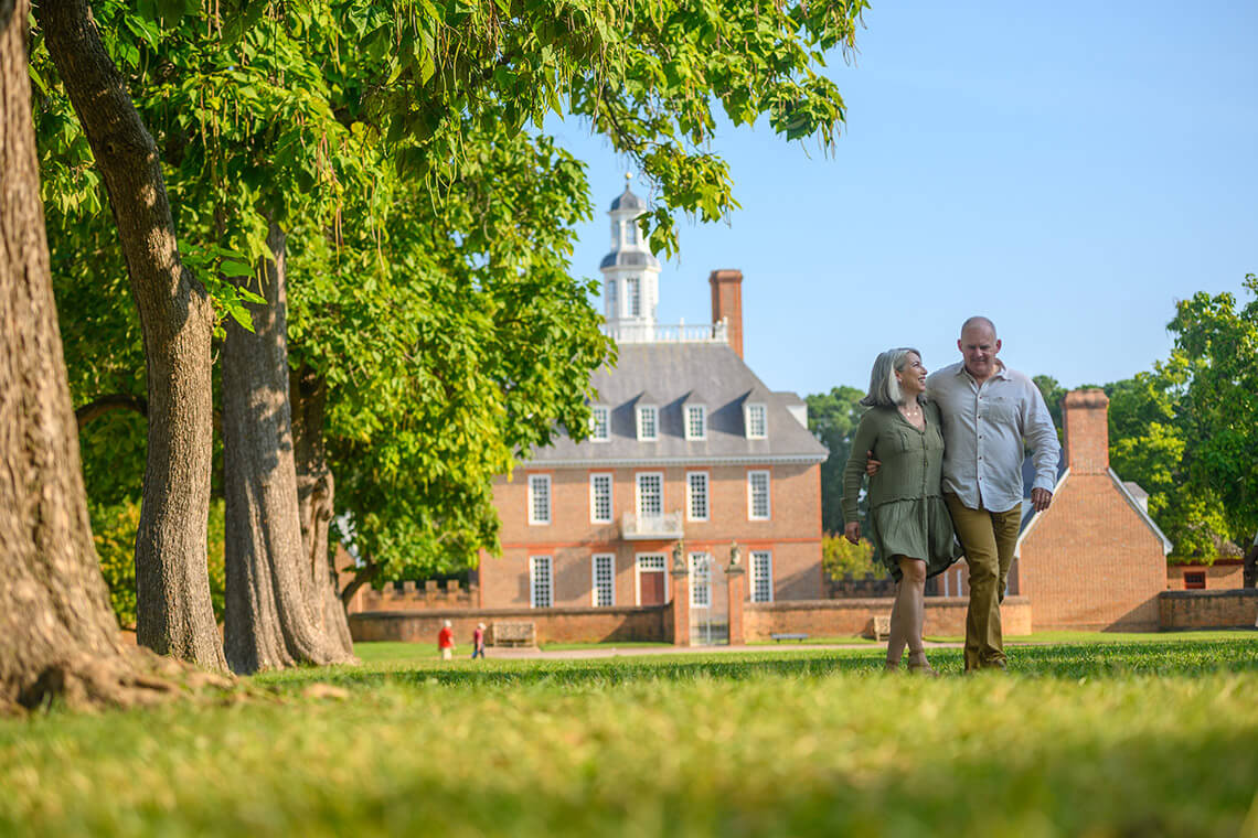 Couple walks outside of Governor's Palace in Williamsburg