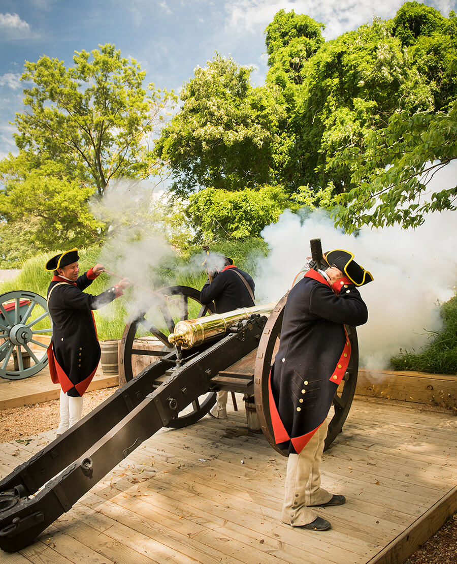 History interpreters fire cannons at Yorktown, VA