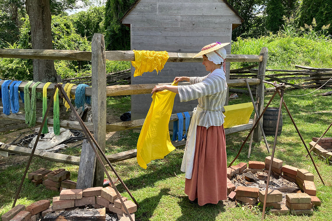Woman hand-dyes fabric in Yorktown