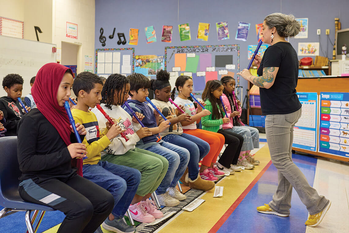 Cara Furness leads her class on the recorder
