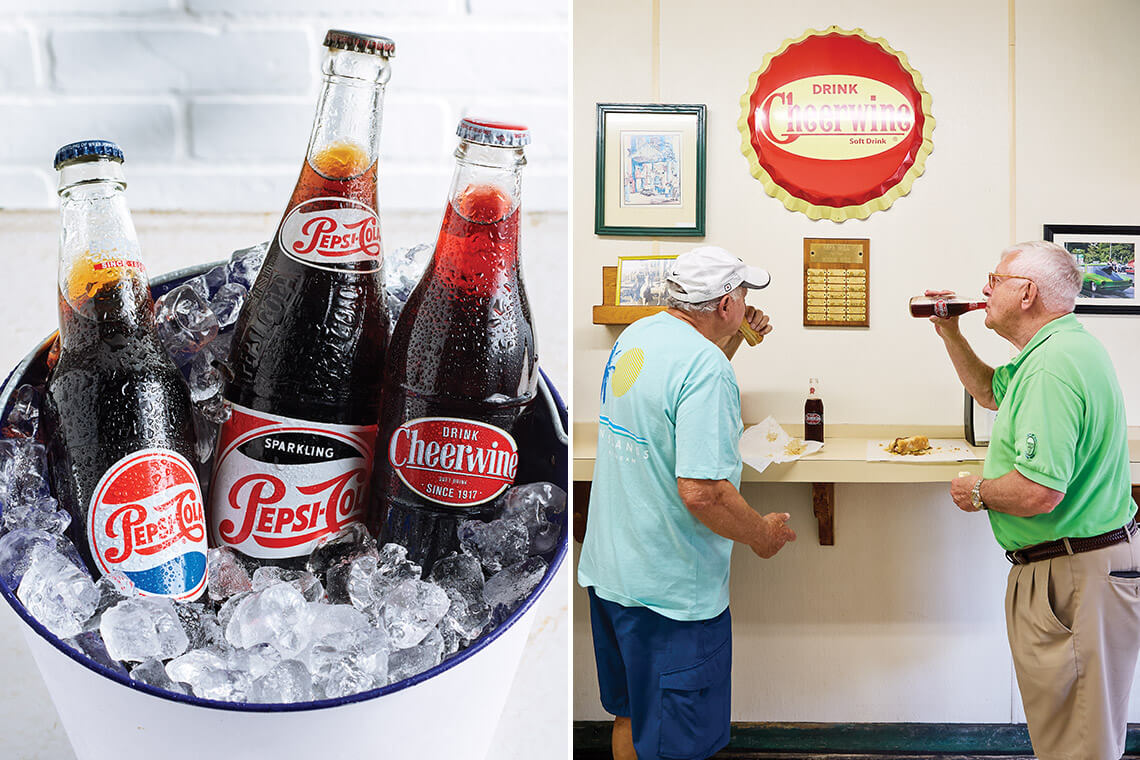 Bucket of soda bottles, two men drink Cheerwine