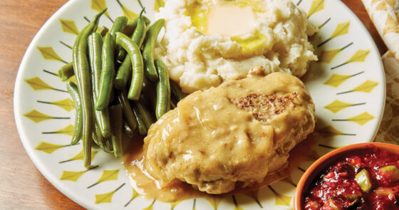 Plate with Salisbury steak, green beans, and potatoes