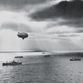 Blimp flying over Naval convoy