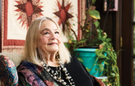 Cynthia Moore Brown seated in her home
