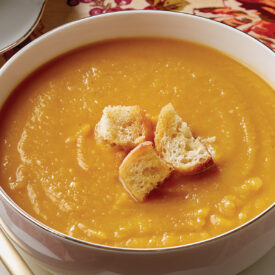Bowl of butternut squash soup with croutons