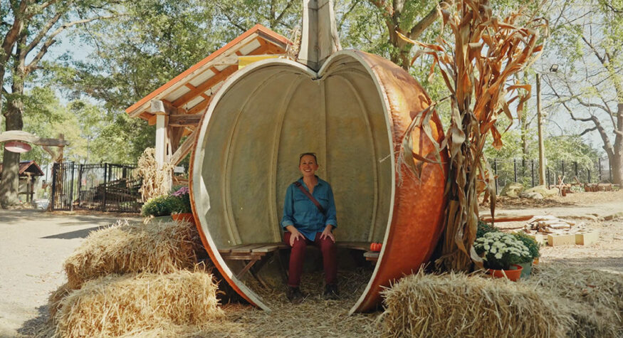 Woman in a hollow pumpkin structure